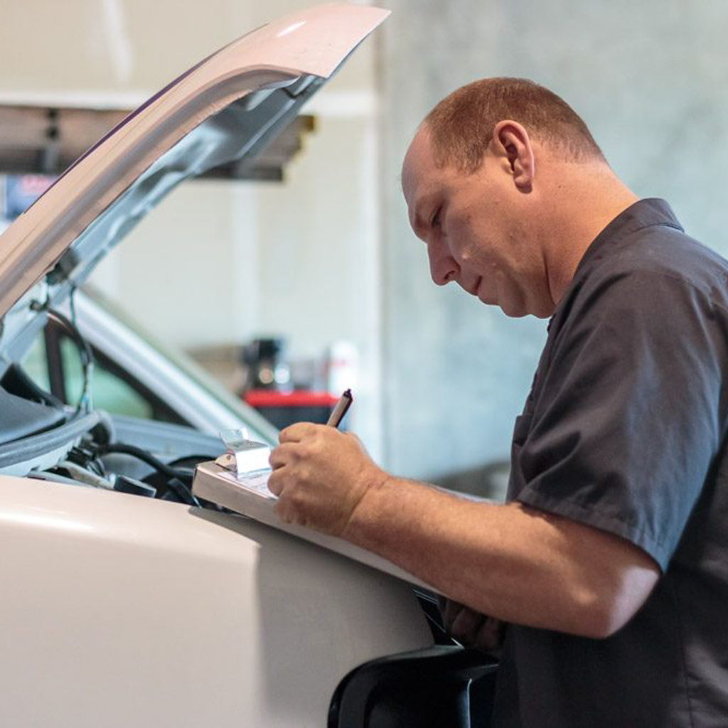 Mechanic working on vehicle